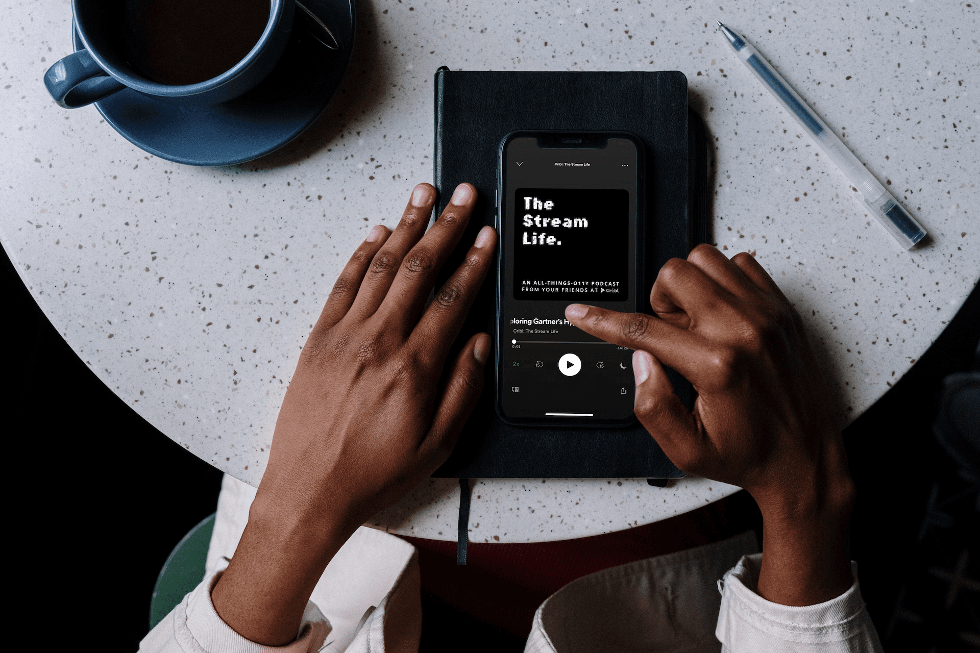 mockuuups-iphone-mockup-on-black-notebook-with-pen-by-the-side