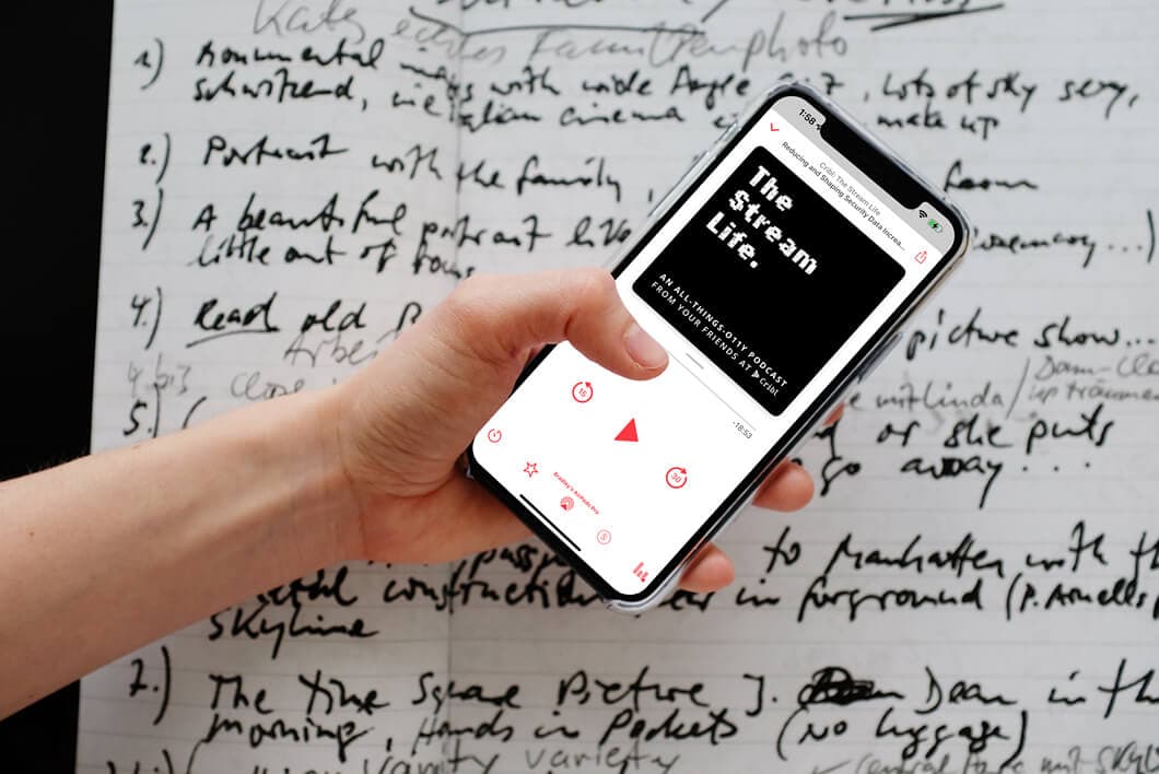 mockuuups-iphone-12-pro-mockup-held-over-a-sheet-of-paper