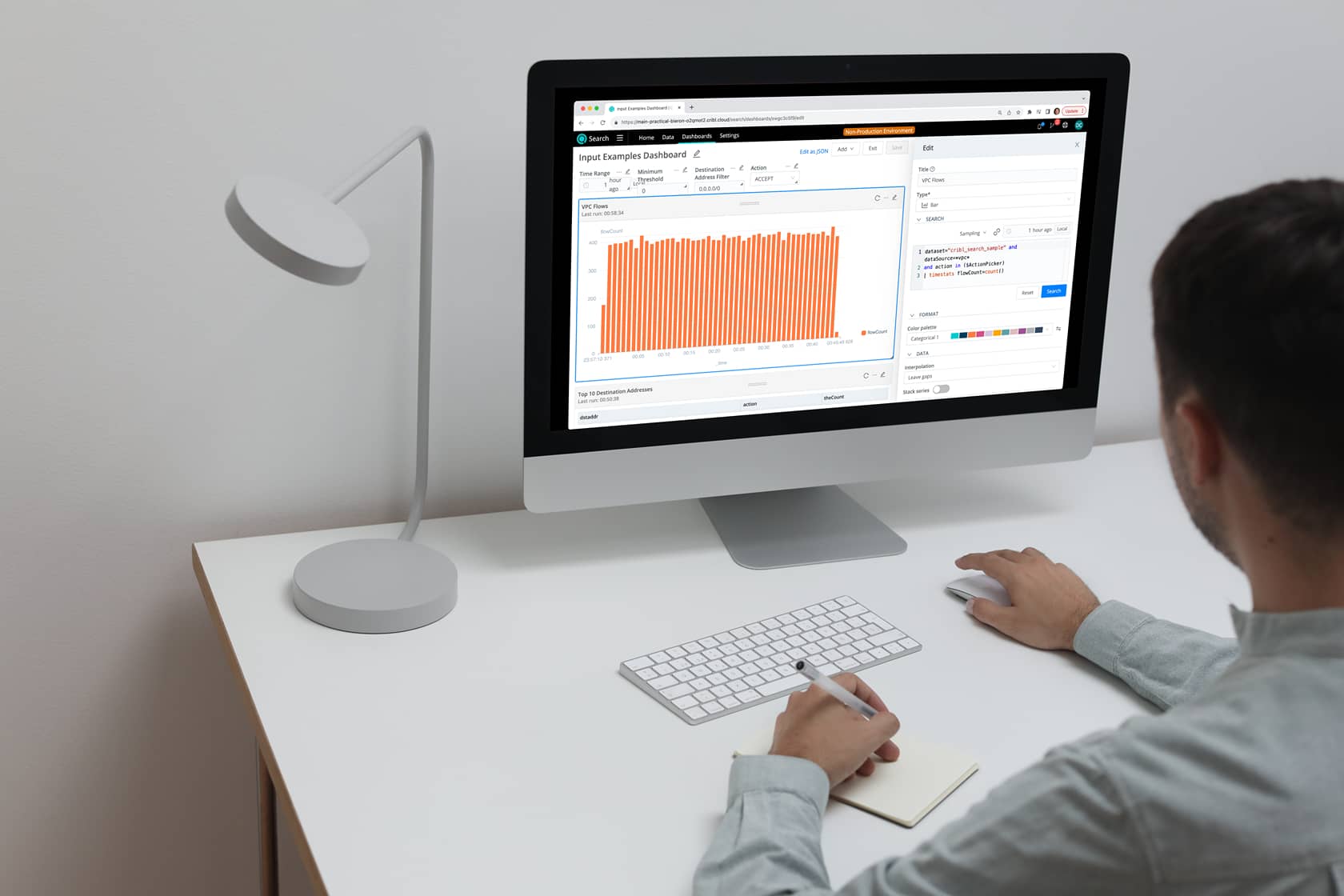 mockuuups-mockup-user-using-an-imac-and-writing-into-a-notepad-2